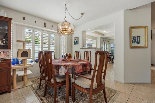 5015 Alicante Way, Oceanside, CA 92056 - dining area featuring light tile patterned floors, healthy amount of natural light, a chandelier, and baseboards