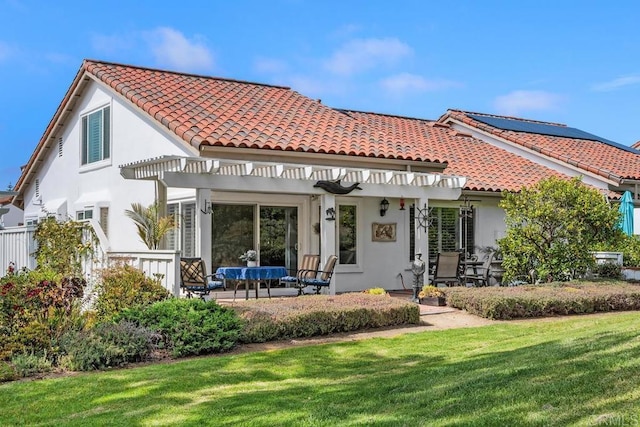 5015 Alicante Way, Oceanside, CA 92056 - back of property with a tiled roof, stucco siding, a pergola, and a lawn