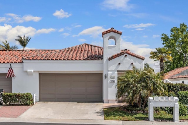 5015 Alicante Way, Oceanside, CA 92056 - mediterranean / spanish-style house with driveway, a garage, and a tiled roof