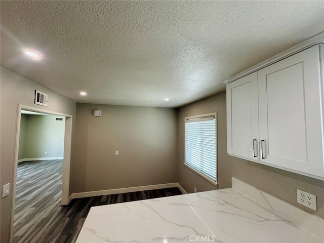 8667 Colorado Ave, Riverside, CA 92504 - unfurnished bedroom featuring dark wood-type flooring, recessed lighting, a textured ceiling, and baseboards