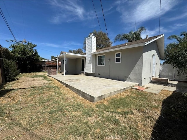 8667 Colorado Ave, Riverside, CA 92504 - back of house featuring a patio area, stucco siding, and a chimney
