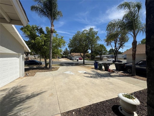 8667 Colorado Ave, Riverside, CA 92504 - view of concrete driveway with a residential view