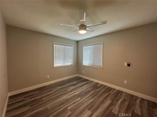 8667 Colorado Ave, Riverside, CA 92504 - spare room featuring dark wood-style floors, a ceiling fan, and baseboards
