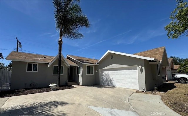 8667 Colorado Ave, Riverside, CA 92504 - ranch-style house featuring stucco siding, a garage, and driveway