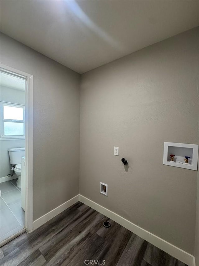 8667 Colorado Ave, Riverside, CA 92504 - washroom featuring hookup for a washing machine, baseboards, and dark wood finished floors