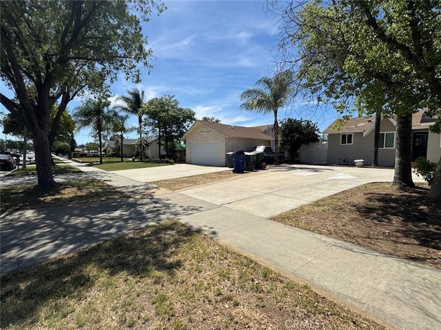 8667 Colorado Ave, Riverside, CA 92504 - view of front of house with driveway, a garage, and stucco siding