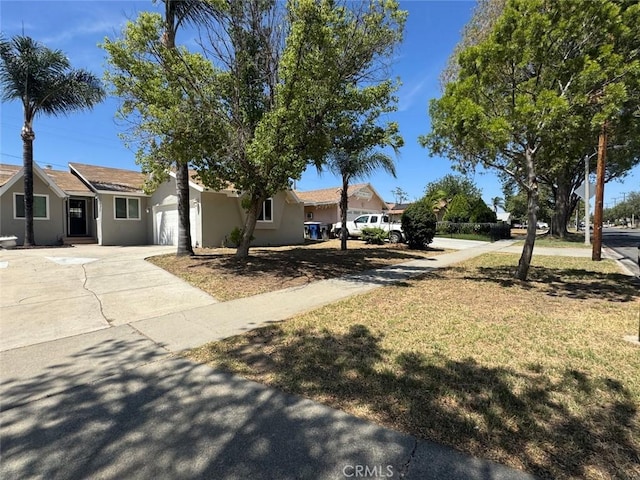 8667 Colorado Ave, Riverside, CA 92504 - view of front of property with driveway, a garage, and stucco siding