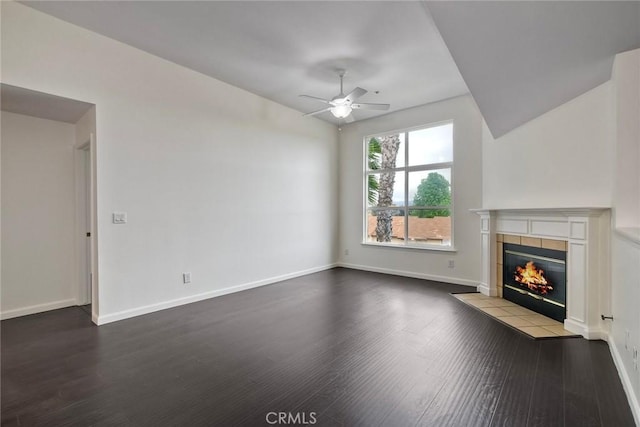 150 N River Cir Unit 306, Oceanside, CA 92057 - unfurnished living room with wood finished floors, a ceiling fan, a tile fireplace, and baseboards