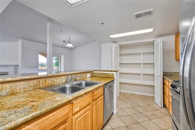 150 N River Cir Unit 306, Oceanside, CA 92057 - kitchen featuring appliances with stainless steel finishes, a sink, and light tile patterned flooring