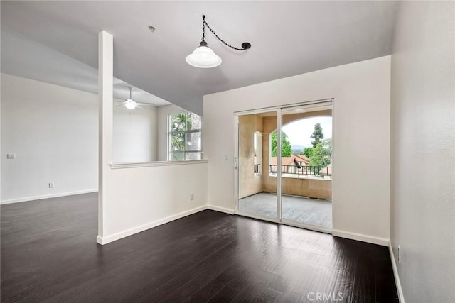 150 N River Cir Unit 306, Oceanside, CA 92057 - empty room with dark wood-type flooring, ceiling fan, and baseboards