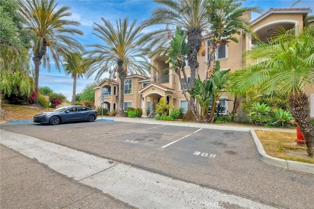 150 N River Cir Unit 306, Oceanside, CA 92057 - view of property featuring uncovered parking