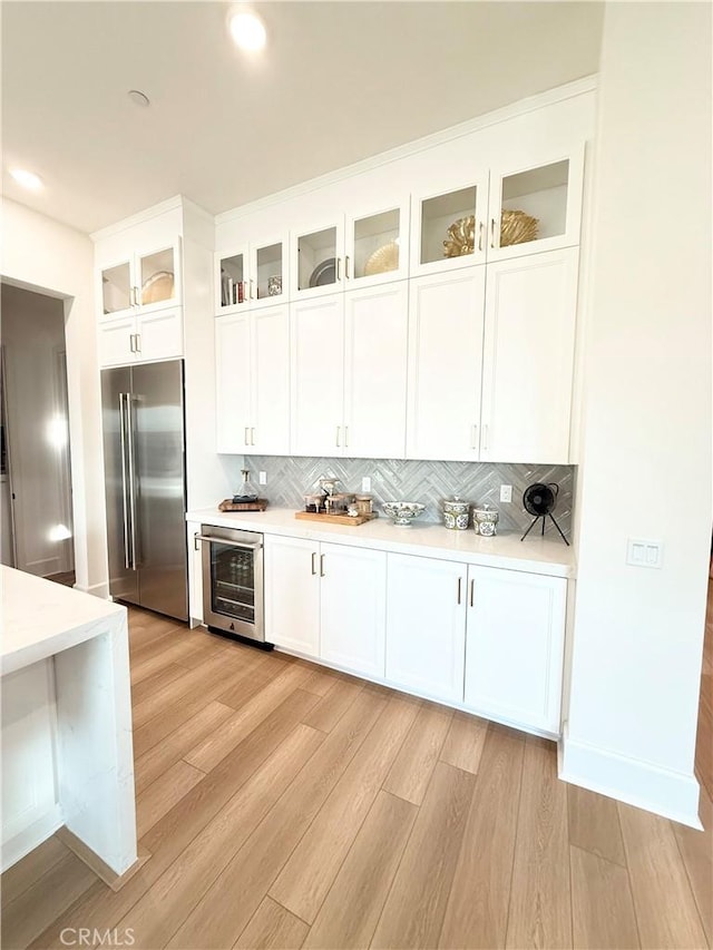 8896 Los Coyotes Ct Unit 410, Buena Park, CA 90621 - kitchen with high end fridge, wine cooler, light countertops, and recessed lighting