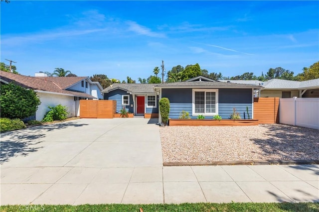 5112 Topanga Canyon Blvd, Woodland Hills, CA 91364 - ranch-style home featuring a gate and driveway