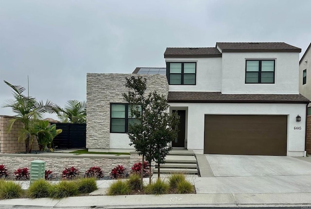 6445 Fischer Way, Carmel Valley, CA 92130 - contemporary home with stucco siding, driveway, an attached garage, and stone siding