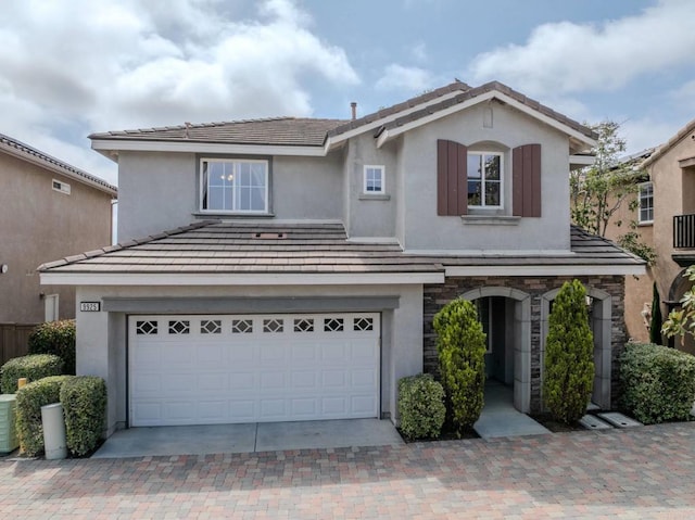 9925 Fieldthorn St, San Diego, CA 92127 - traditional-style home with stucco siding, an attached garage, stone siding, and driveway
