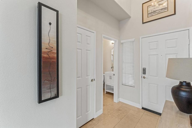 9925 Fieldthorn St, San Diego, CA 92127 - entryway featuring light tile patterned flooring and baseboards