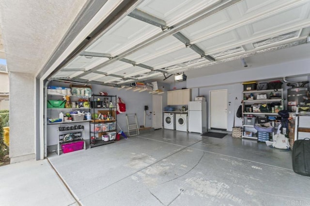 9925 Fieldthorn St, San Diego, CA 92127 - garage featuring washer and dryer, freestanding refrigerator, and a garage door opener