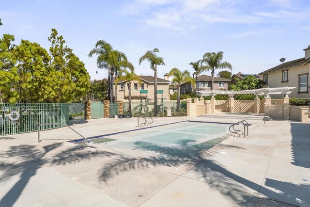 9925 Fieldthorn St, San Diego, CA 92127 - view of pool featuring a residential view, a pergola, and a patio area