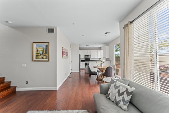 9925 Fieldthorn St, San Diego, CA 92127 - living room with dark wood-type flooring and stairs