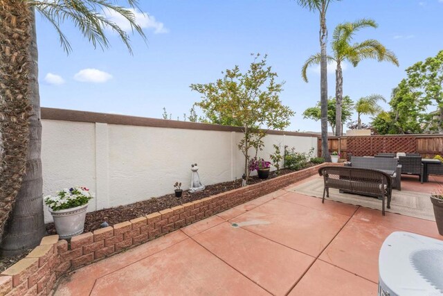 9925 Fieldthorn St, San Diego, CA 92127 - fenced backyard featuring a patio area and outdoor lounge area