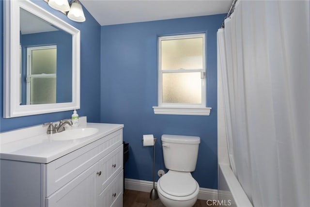 8390 Curbaril Ave, Atascadero, CA 93422 - bathroom featuring vanity, toilet, baseboards, shower / bath combo with shower curtain, and wood finished floors