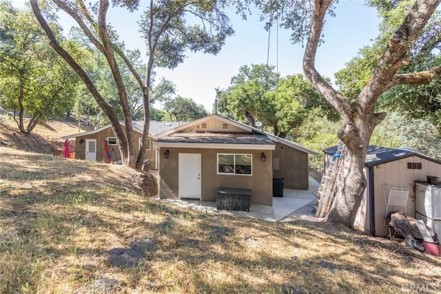 8390 Curbaril Ave, Atascadero, CA 93422 - rear view of house featuring stucco siding, a patio area, and a shingled roof