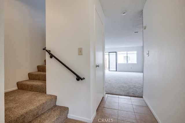 12143 Stonegate Ln, Garden Grove, CA 92845 - staircase with carpet, baseboards, and tile patterned flooring