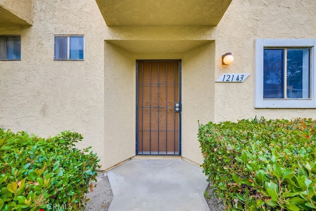 12143 Stonegate Ln, Garden Grove, CA 92845 - property entrance featuring stucco siding