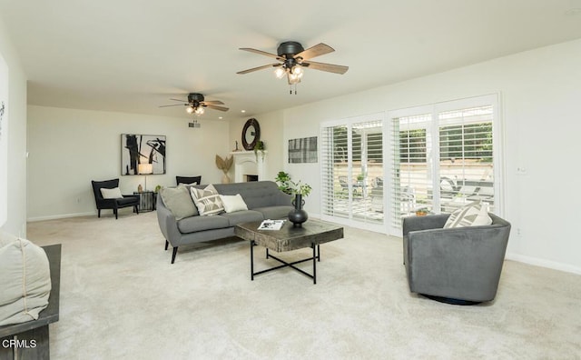 10503 Jimenez St, Sylmar, CA 91342 - living room featuring light colored carpet, a ceiling fan, and baseboards