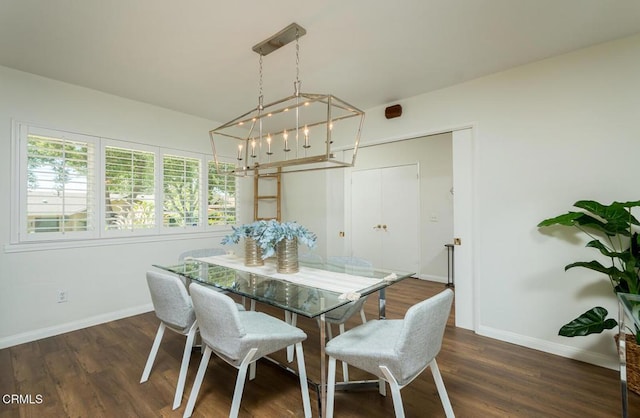 10503 Jimenez St, Sylmar, CA 91342 - dining area featuring baseboards, a chandelier, and dark wood-style flooring