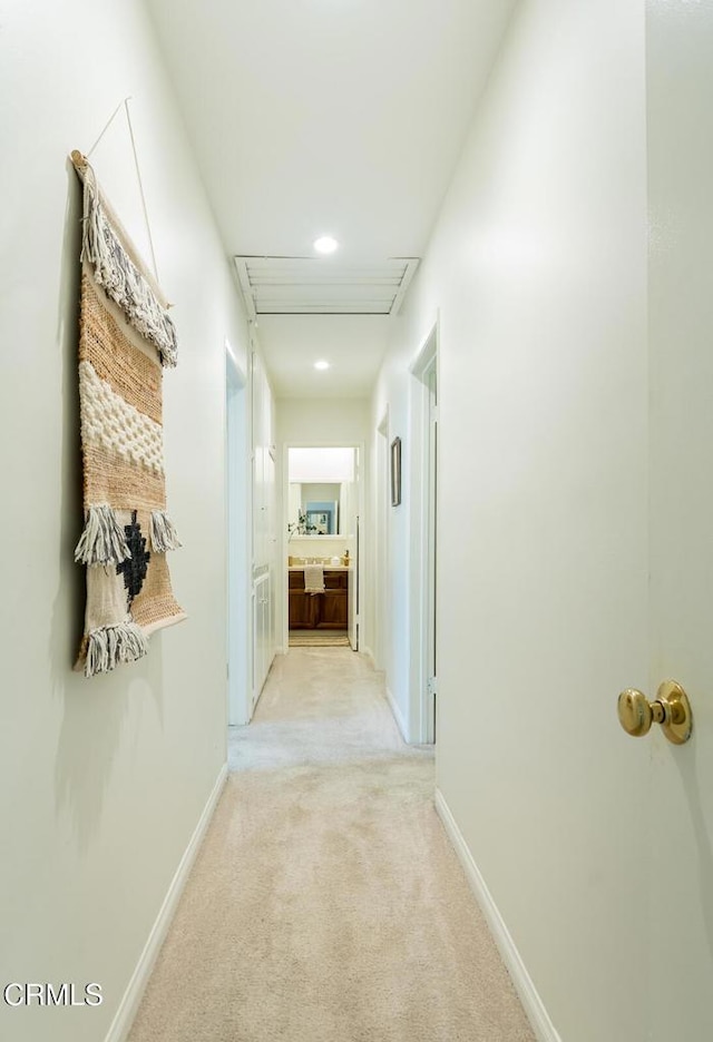 10503 Jimenez St, Sylmar, CA 91342 - hall featuring light colored carpet, baseboards, and recessed lighting