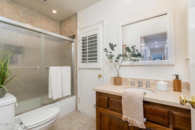 10503 Jimenez St, Sylmar, CA 91342 - bathroom featuring toilet, vanity, enclosed tub / shower combo, tile patterned floors, and recessed lighting