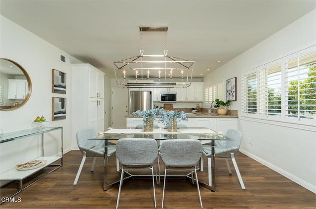 10503 Jimenez St, Sylmar, CA 91342 - dining space featuring a chandelier, baseboards, dark wood-style flooring, and recessed lighting