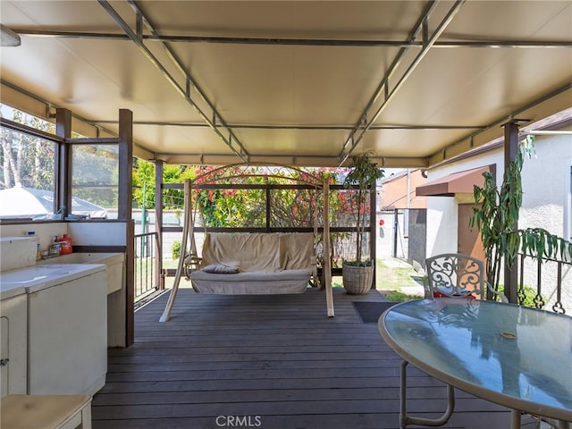 5526 W 118th Pl, Hawthorne, CA 90304 - wooden deck with outdoor dining area and a sink