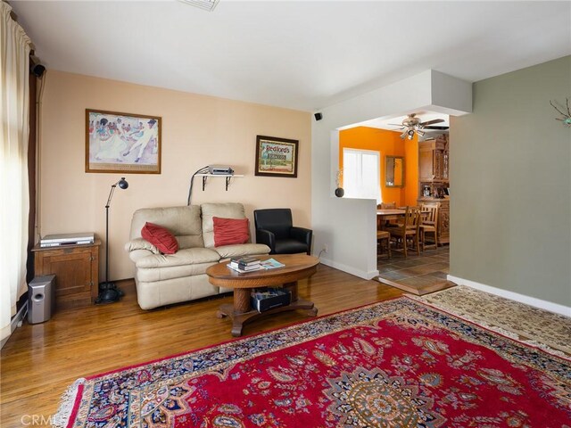 5526 W 118th Pl, Hawthorne, CA 90304 - living room with ceiling fan, wood finished floors, and baseboards