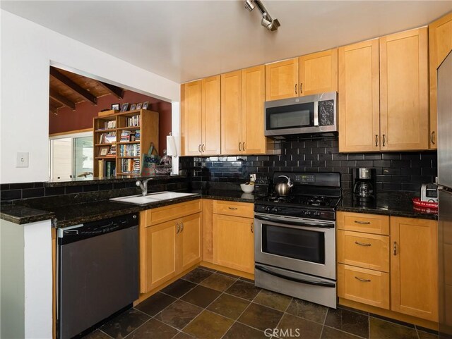 5526 W 118th Pl, Hawthorne, CA 90304 - kitchen with appliances with stainless steel finishes, a sink, light brown cabinets, tasteful backsplash, and dark stone finish flooring