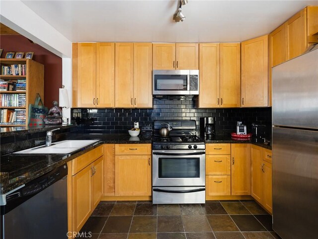 5526 W 118th Pl, Hawthorne, CA 90304 - kitchen featuring appliances with stainless steel finishes, a sink, tasteful backsplash, and stone finish floors