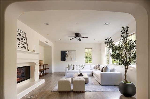 47 Via Alcamo, San Clemente, CA 92673 - living area featuring healthy amount of natural light, arched walkways, a ceiling fan, wood finished floors, and recessed lighting