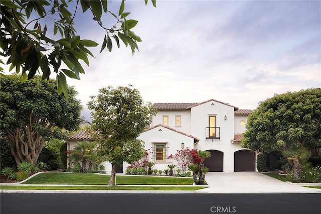 47 Via Alcamo, San Clemente, CA 92673 - mediterranean / spanish house featuring driveway, a garage, a tile roof, stucco siding, and a balcony