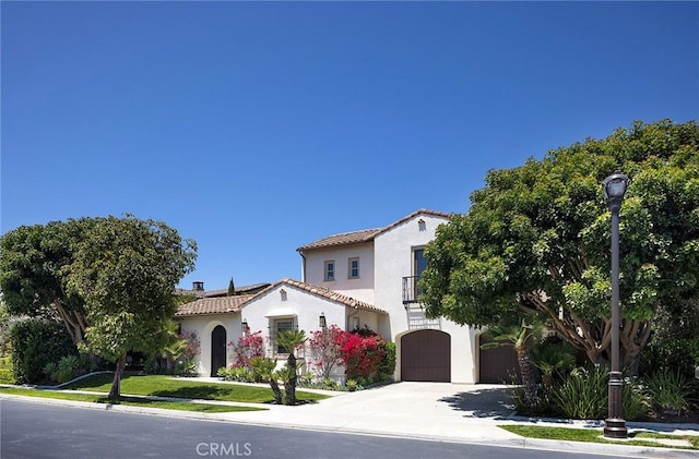 47 Via Alcamo, San Clemente, CA 92673 - mediterranean / spanish house with a balcony, concrete driveway, a tile roof, an attached garage, and stucco siding