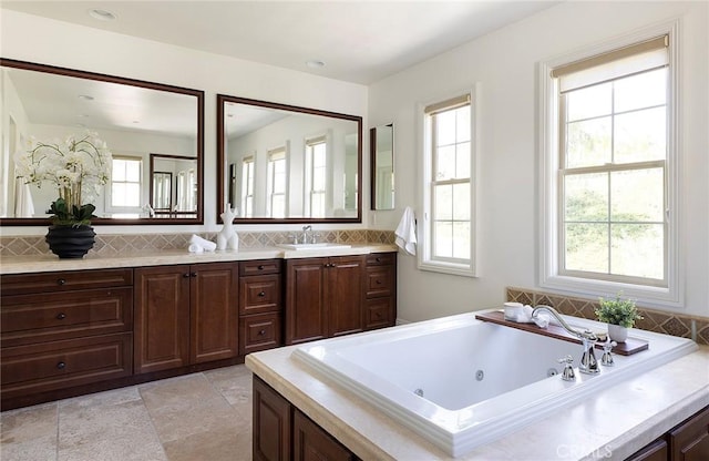 47 Via Alcamo, San Clemente, CA 92673 - full bath with plenty of natural light, a whirlpool tub, double vanity, and backsplash