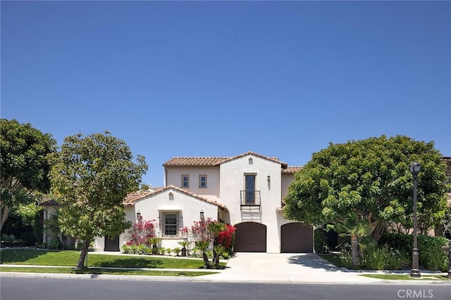 47 Via Alcamo, San Clemente, CA 92673 - mediterranean / spanish-style house featuring a balcony, a garage, concrete driveway, a tiled roof, and stucco siding