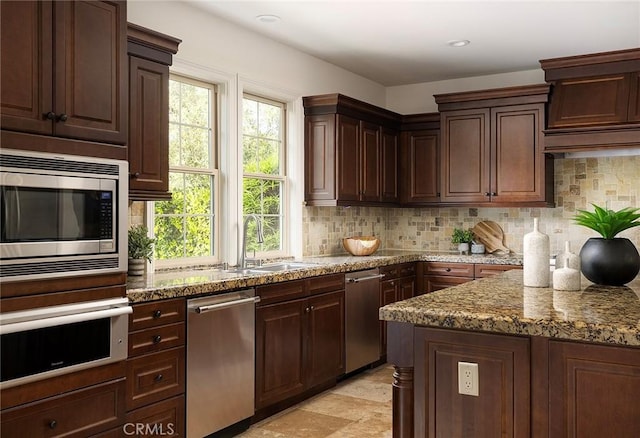47 Via Alcamo, San Clemente, CA 92673 - kitchen featuring stainless steel appliances, decorative backsplash, dark stone countertops, a sink, and a warming drawer