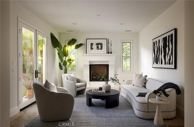47 Via Alcamo, San Clemente, CA 92673 - living area with a fireplace with raised hearth and french doors
