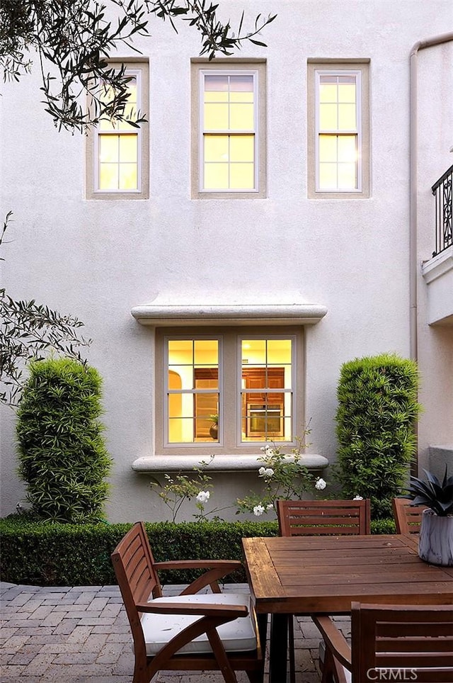 47 Via Alcamo, San Clemente, CA 92673 - back of property featuring stucco siding, outdoor dining area, and a patio