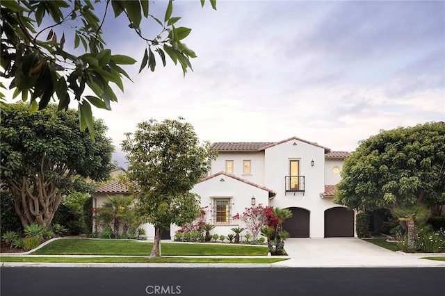 47 Via Alcamo, San Clemente, CA 92673 - mediterranean / spanish home with driveway, an attached garage, a tiled roof, stucco siding, and a balcony