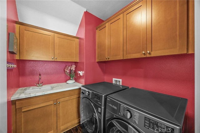 4267 Carnegie Ct, Riverside, CA 92505 - washroom featuring cabinet space, washer and dryer, and dark wood-type flooring