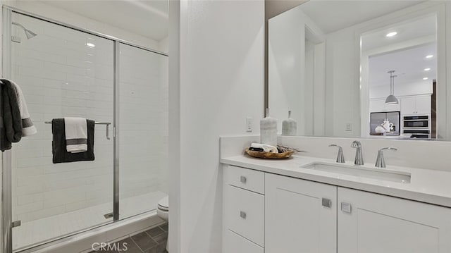 567 Mulligan, Irvine, CA 92618 - full bathroom featuring toilet, a shower stall, vanity, and recessed lighting