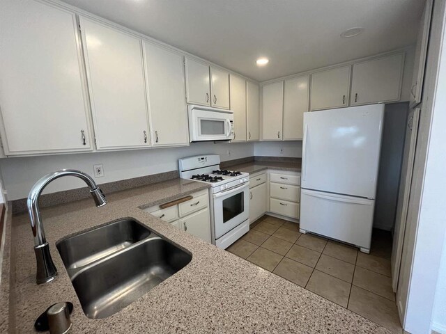 2556 Ocean Cove Dr, Cardiff By The Sea, CA 92007 - kitchen featuring white appliances, white cabinetry, recessed lighting, light tile patterned floors, and light stone counters