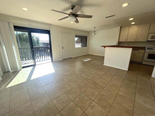 2556 Ocean Cove Dr, Cardiff By The Sea, CA 92007 - kitchen with white appliances, plenty of natural light, tile patterned flooring, recessed lighting, and ceiling fan